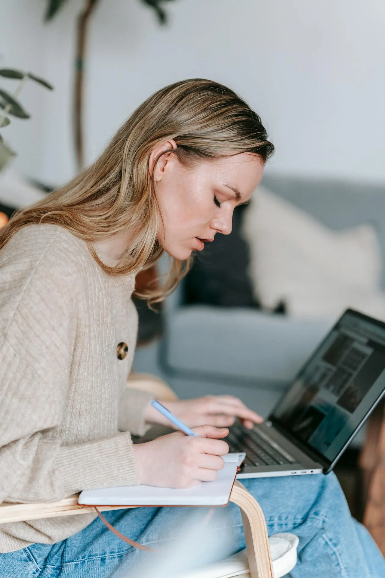 A Student Playbook for Pages That Rank: Local SEO image Student working with laptop and writing notes in planner